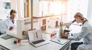 a person using a laptop in a laboratory