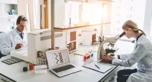 a person using a laptop in a laboratory
