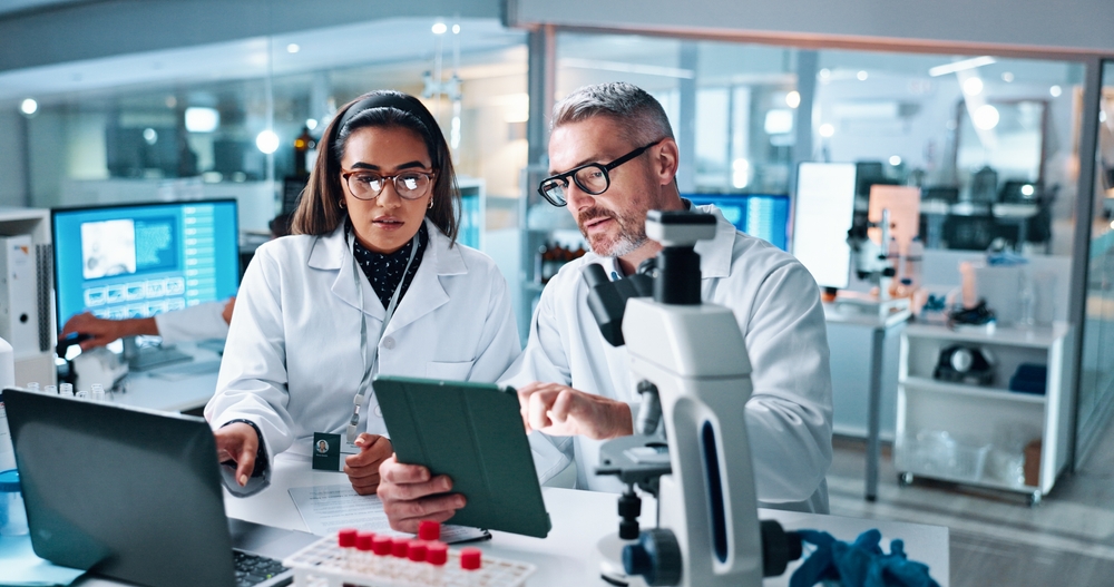 clinical research personnel with computer