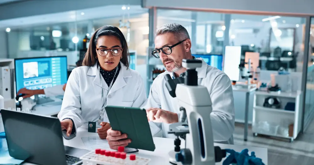 clinical research personnel with computer